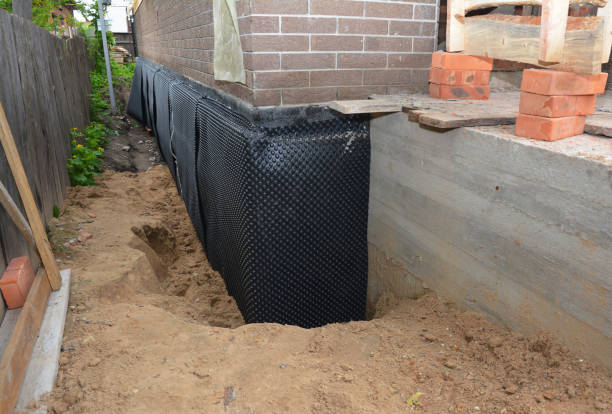 SJ Waterproofing Pros technician performing targeted Interior Drainage System assessment in Caroline, WI